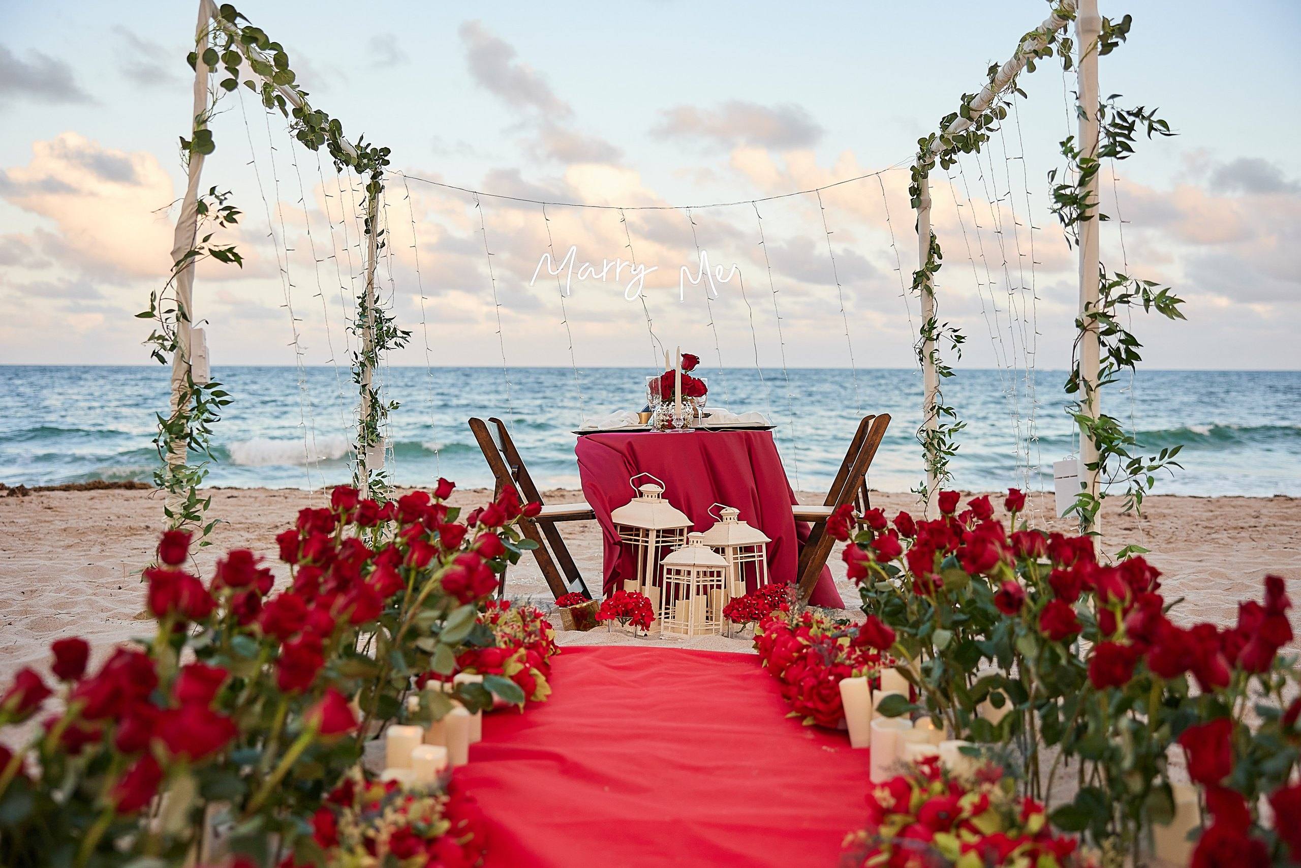 Carpet walkway leading to a dinner table on the beach