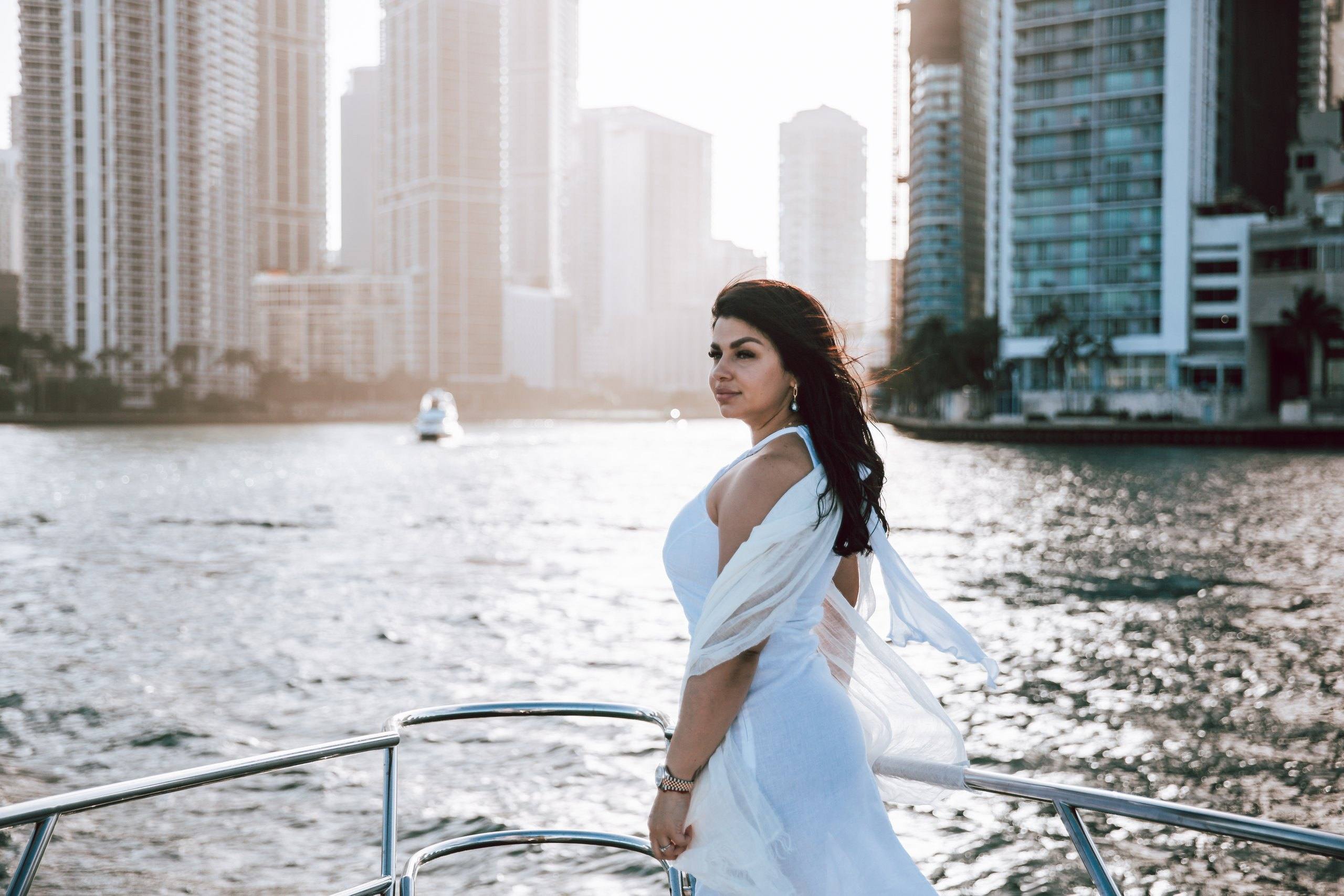 Bride on a yacht with the Miami skyline behind her