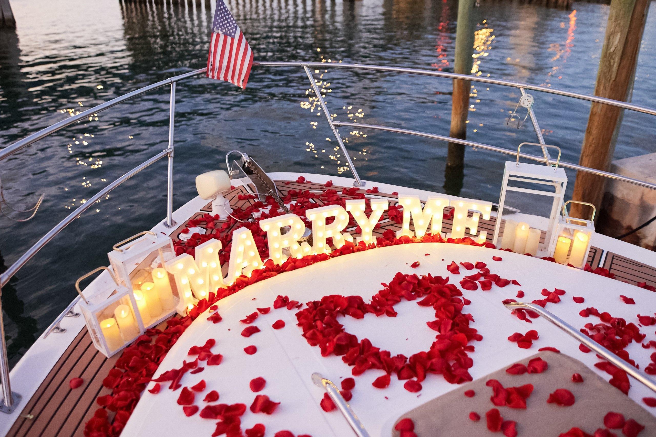 Marry Me letters on the deck of a private yacht